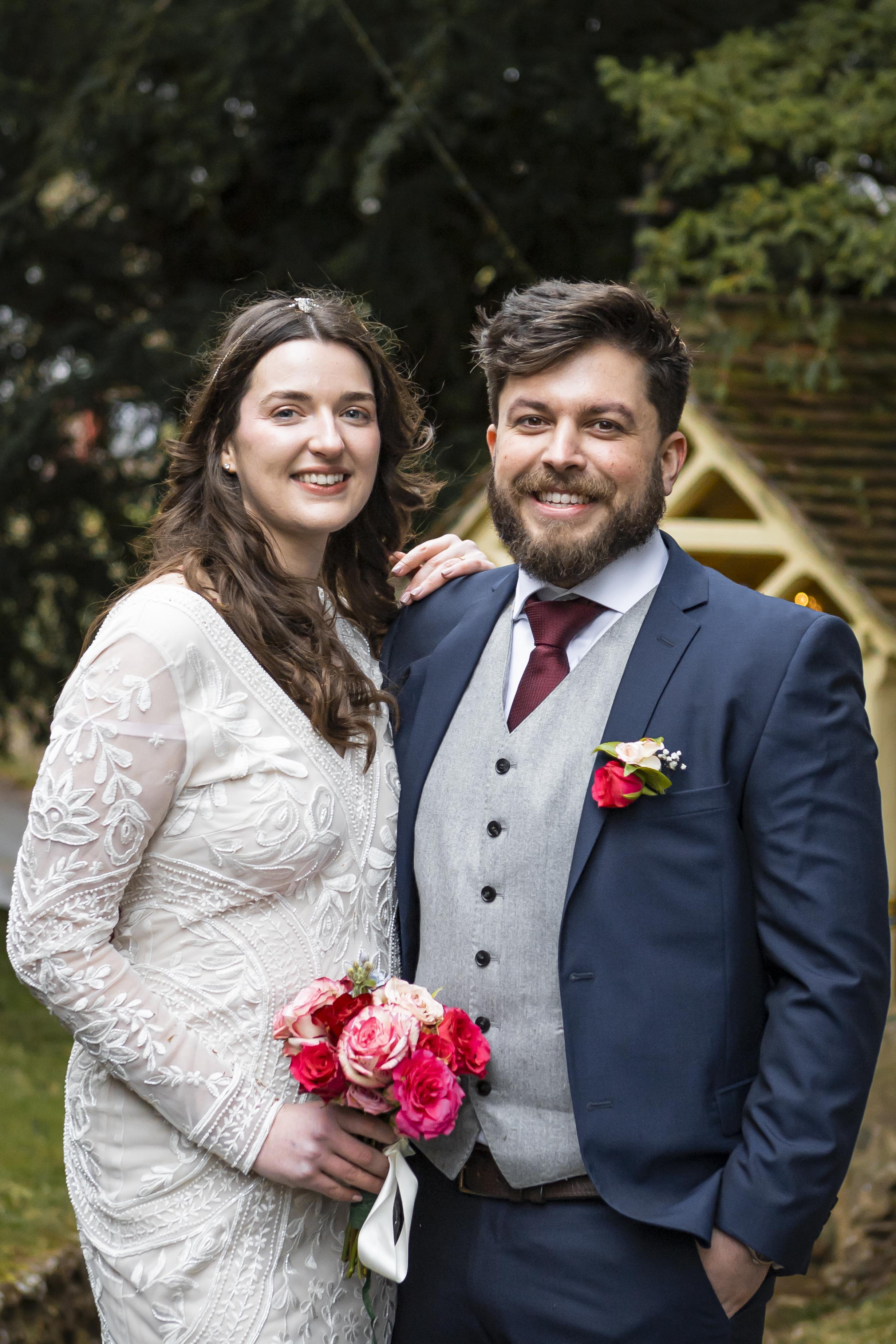 Newlyweds walking outdoors on their wedding day